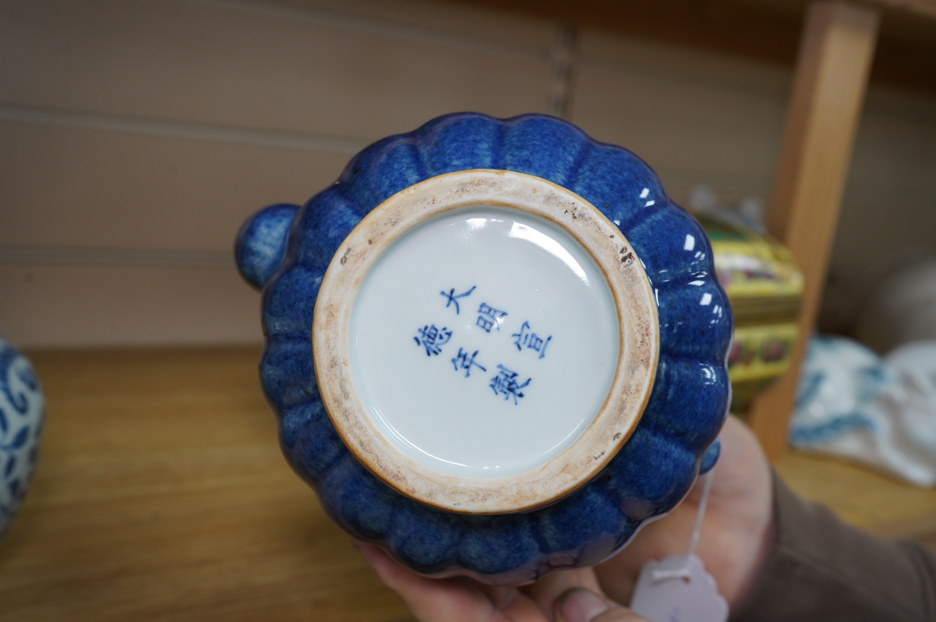 A Chinese porcelain powder blue ewer with cover and a similar blue and white example, largest 25cm high. Condition - good